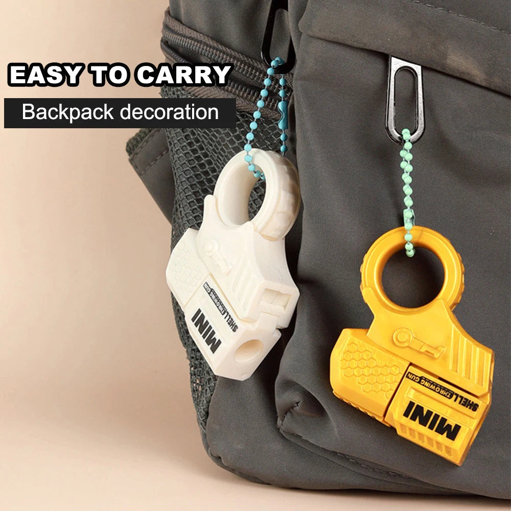Mini Pistol Stress Relief Toys Keychain Decompression Launcher Model Keyring for Woman Men Handbag Accessories Gift